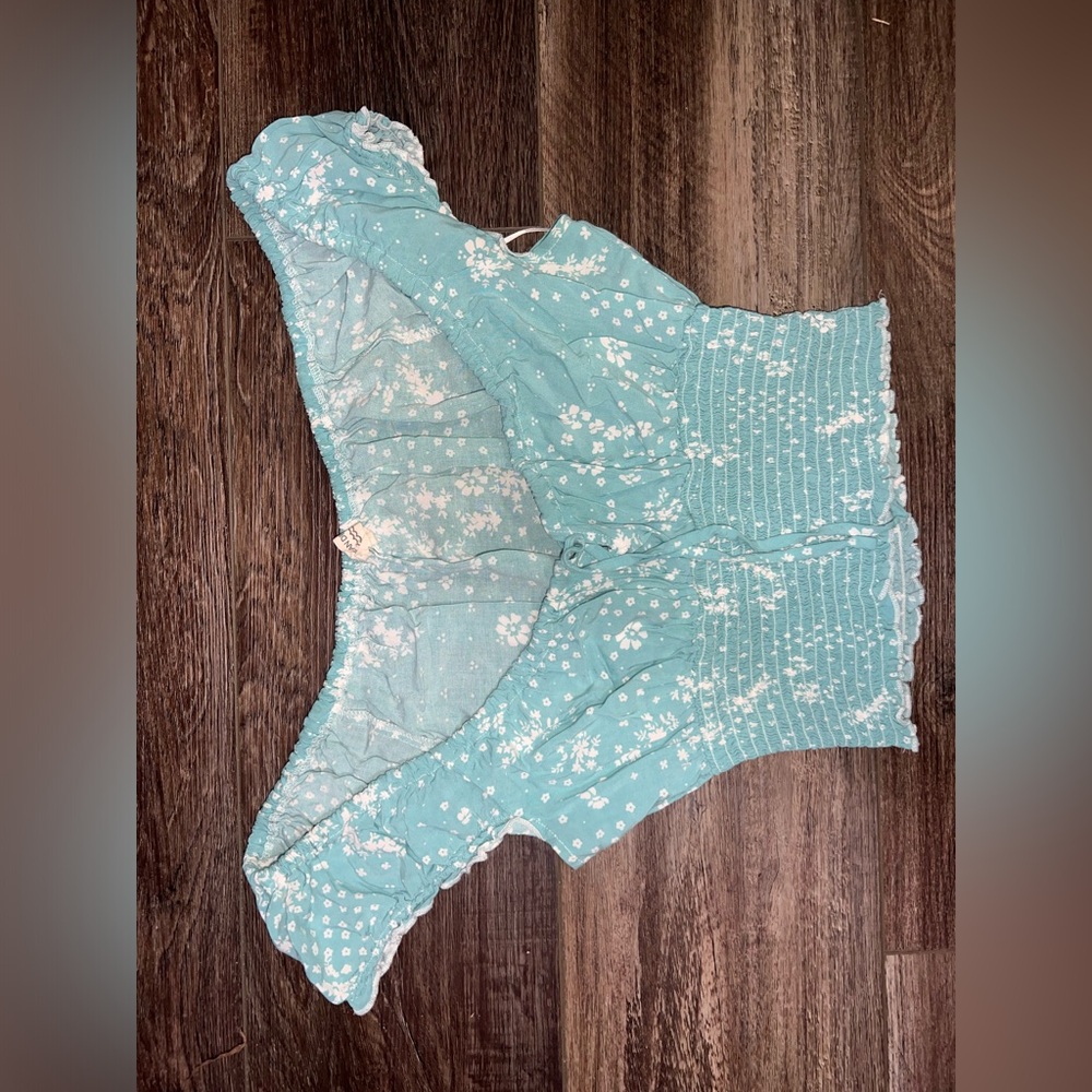 Floral top. The top is adjustable so it’s good for all chest sizes